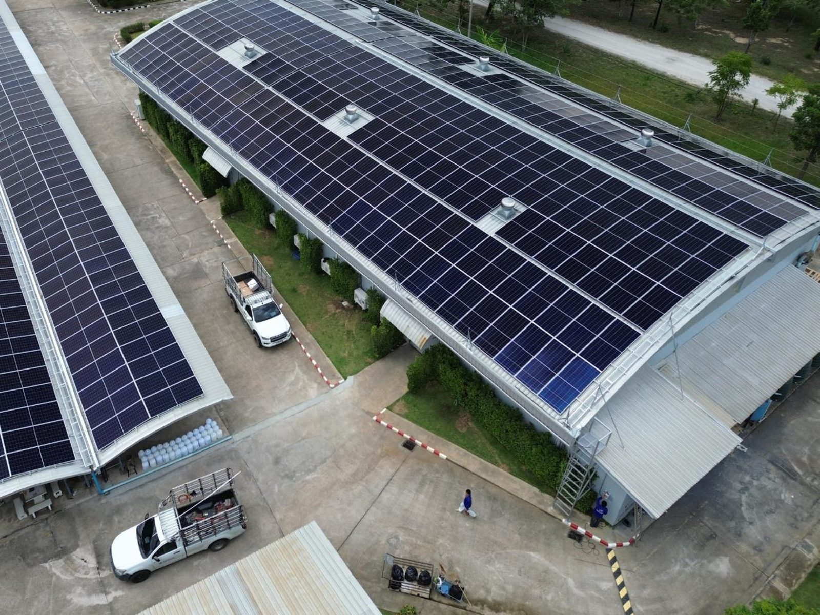 Drone view of two RGA workshop buildings in Lamphun with full rooftop solar coverage